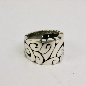 Silver flat band ring with detail of spirals